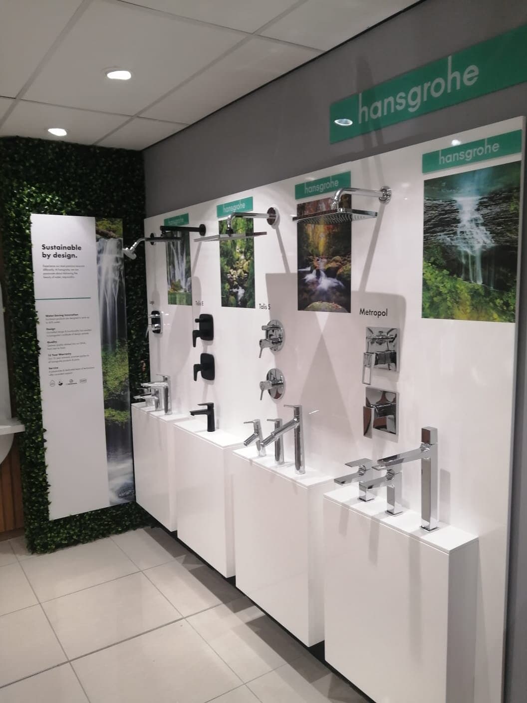Hansgrohe showroom fit-out with wall-mounted tap and shower displays