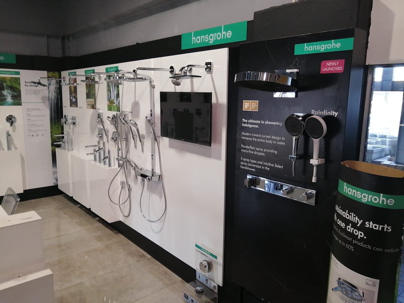 Hansgrohe showroom fit-out with shower displays and a mounted screen